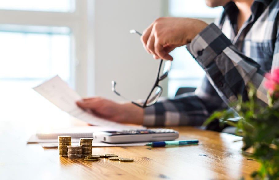 Man checking finances before bankruptcy